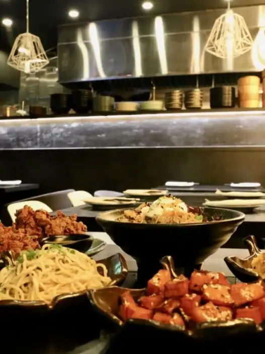Chinese restaurant in Markham serving noodles, fried chicken, and bold appetizers in a sleek, modern setting.