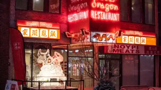 Chinese restaurant in Calgary with glowing red neon lights at night.