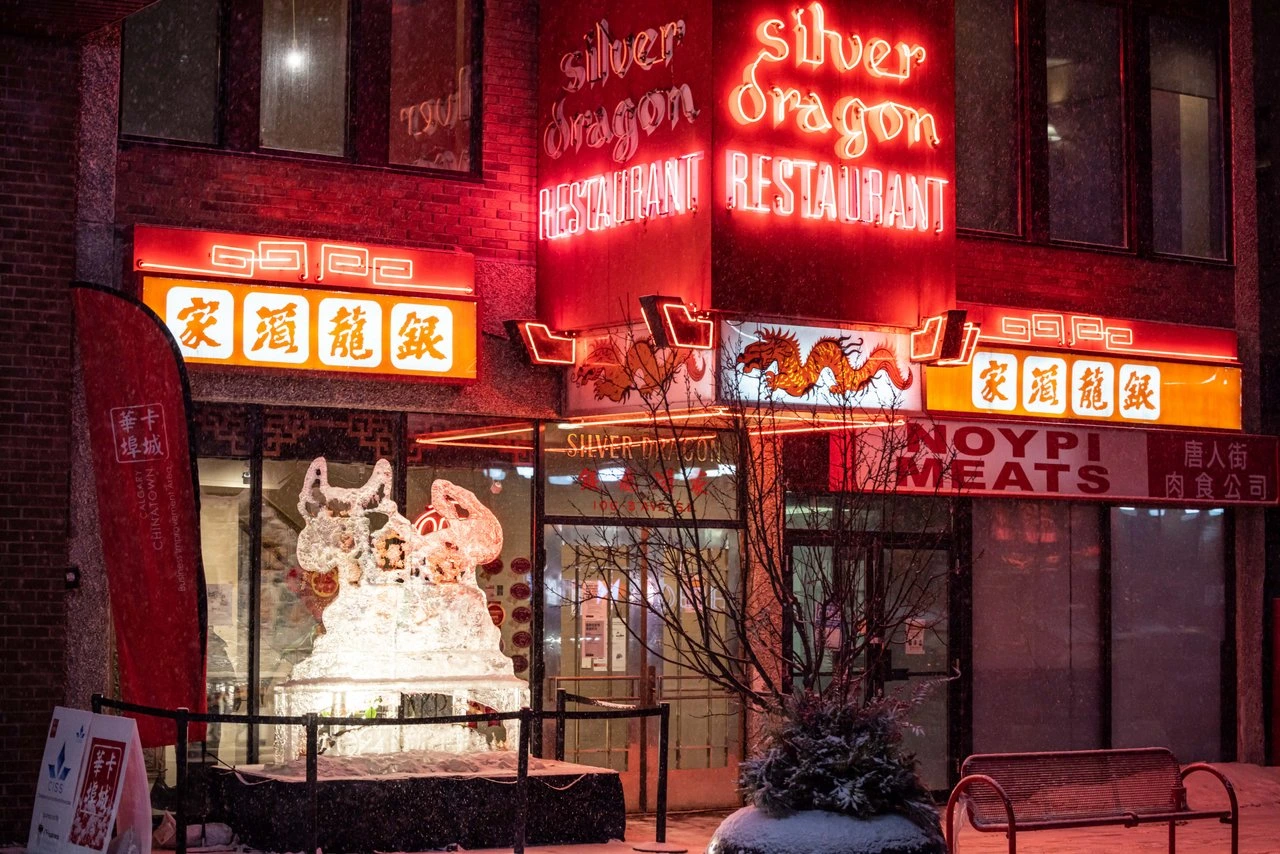 Chinese restaurant in Calgary with glowing red neon lights at night.
