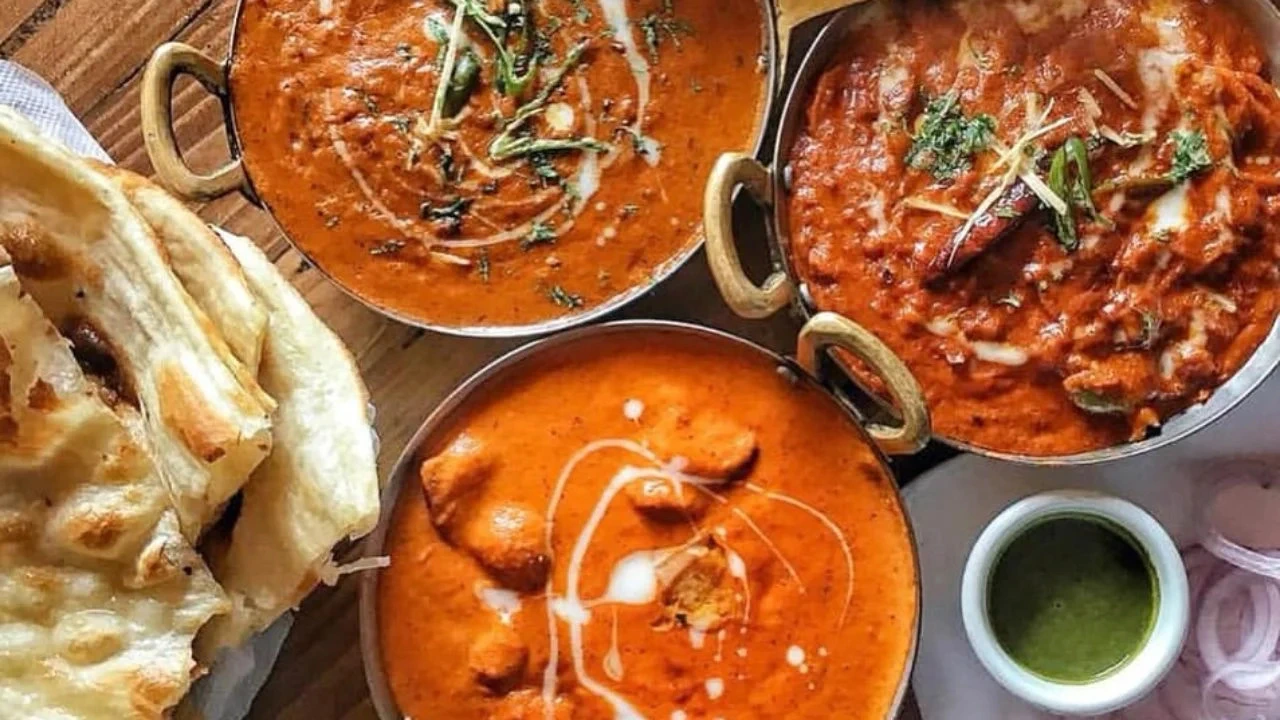 Rich butter chicken, creamy curry, and fresh naan served at a top Indian restaurant in Edmonton