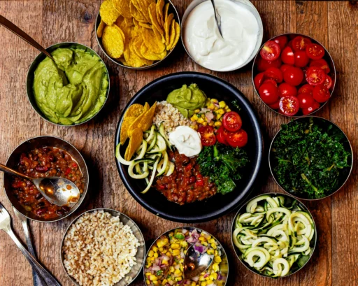 Vibrant vegetarian bowl with fresh veggies, grains, and dips, showcasing healthy vegetarian food in Calgary.