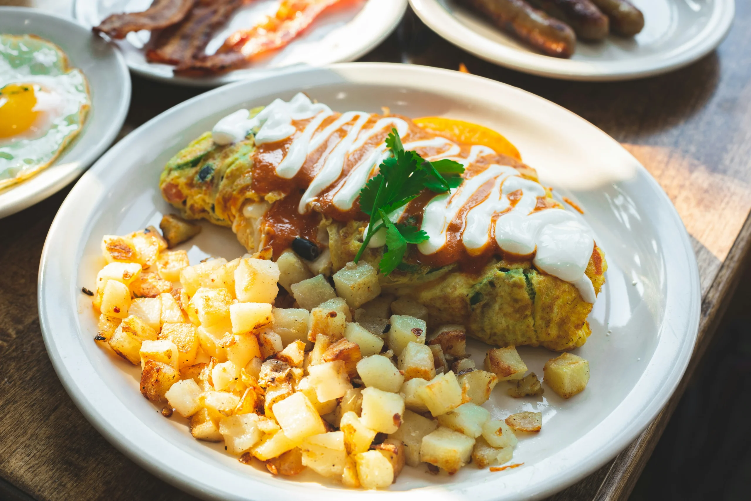Enjoy a loaded omelet and crispy potatoes at a brunch restaurant in Vancouver.