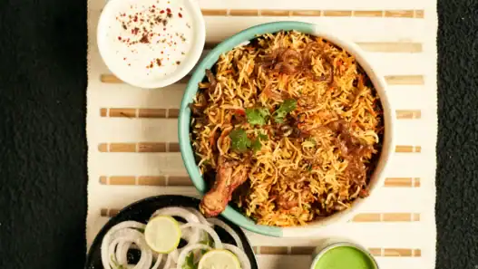 Indian restaurants in Montreal serve biryani and traditional Indian food with yogurt, chutney, and fresh garnishes.