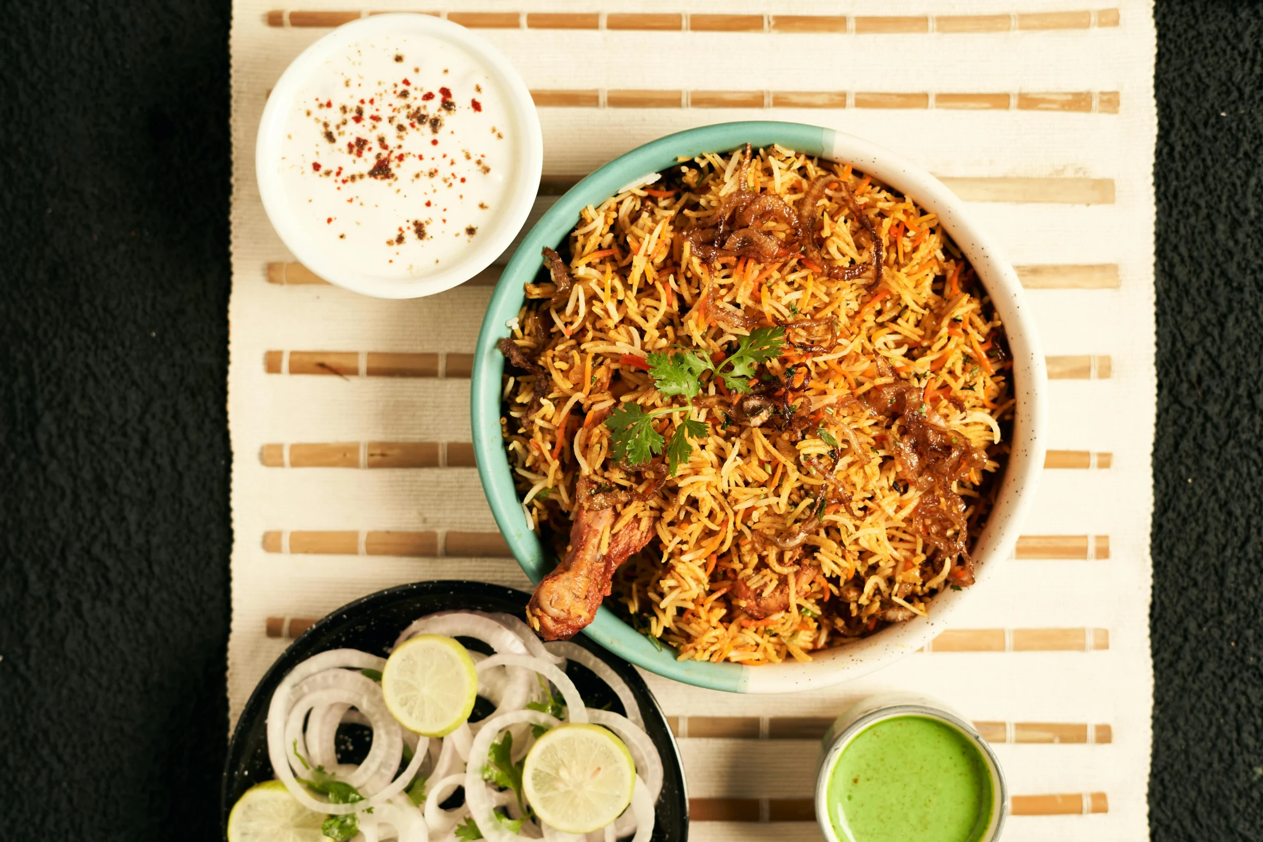 Indian restaurants in Montreal serve biryani and traditional Indian food with yogurt, chutney, and fresh garnishes.